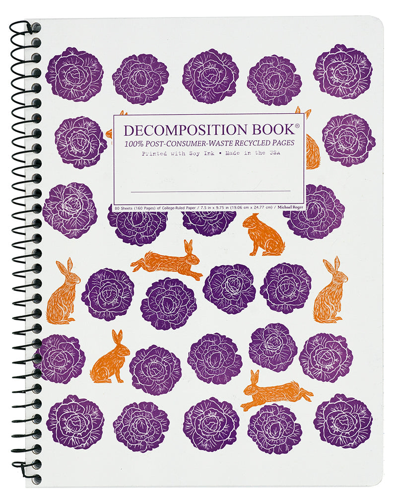 Spiral notebook printed with a pattern of purple cabbages and orange rabbits