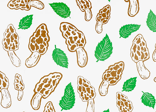 Pattern of brown mushrooms and green leaves on a white background