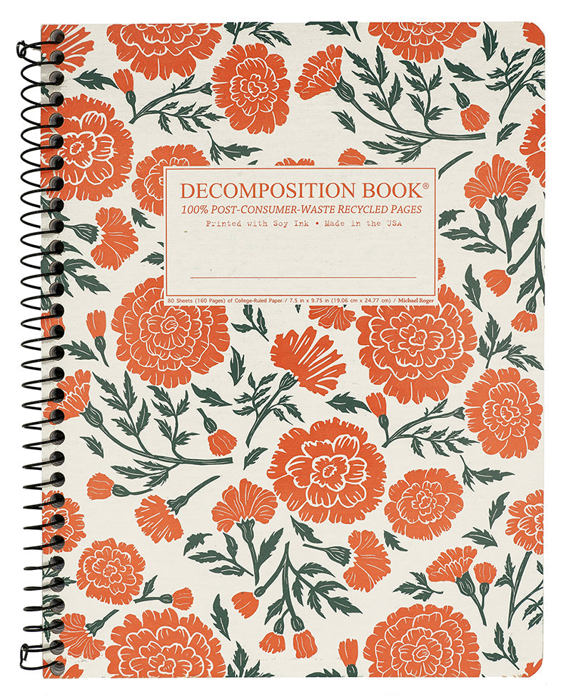 Spiral notebook printed with a pattern of large flowers in orange and green