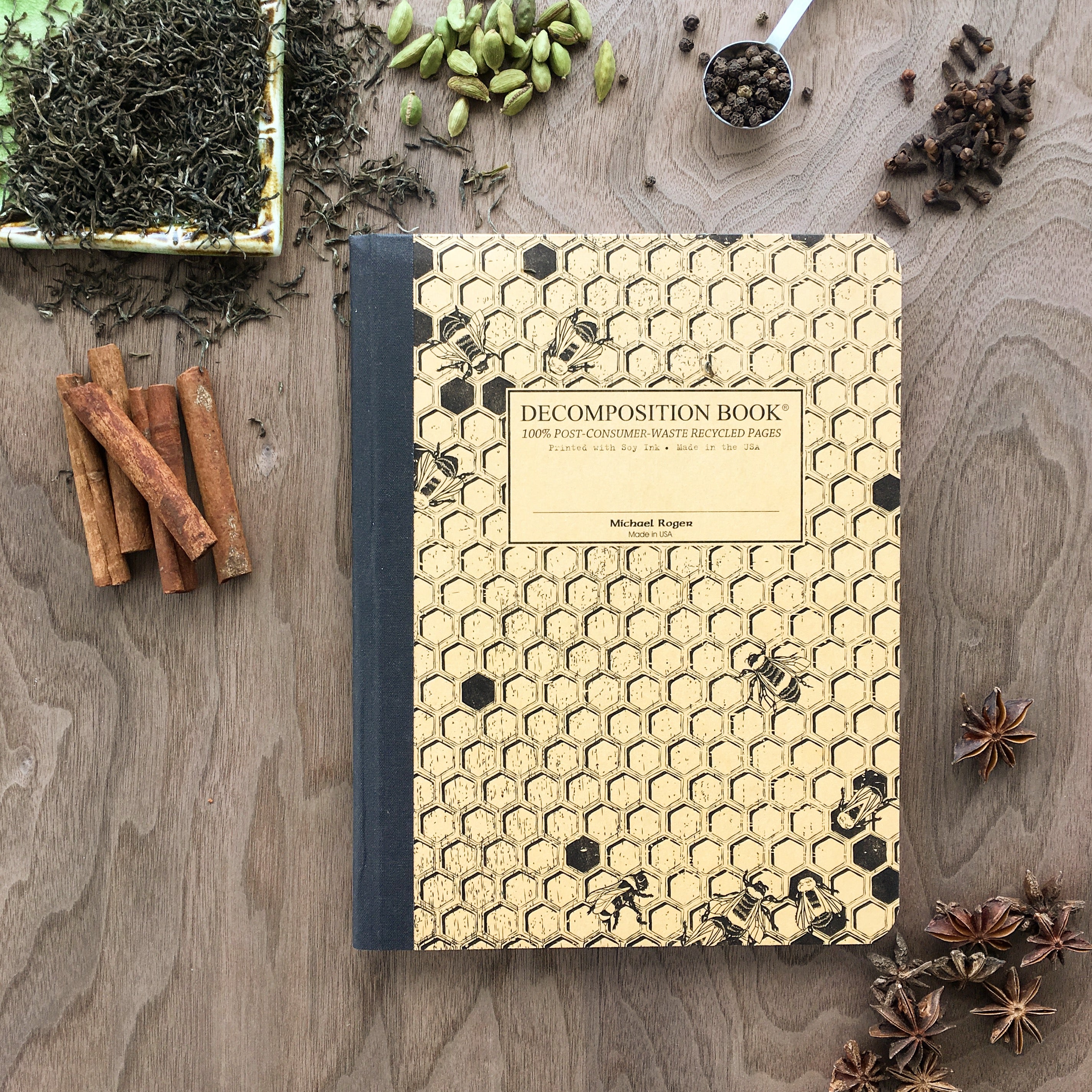 Composition notebook printed with a honeycomb pattern and bees