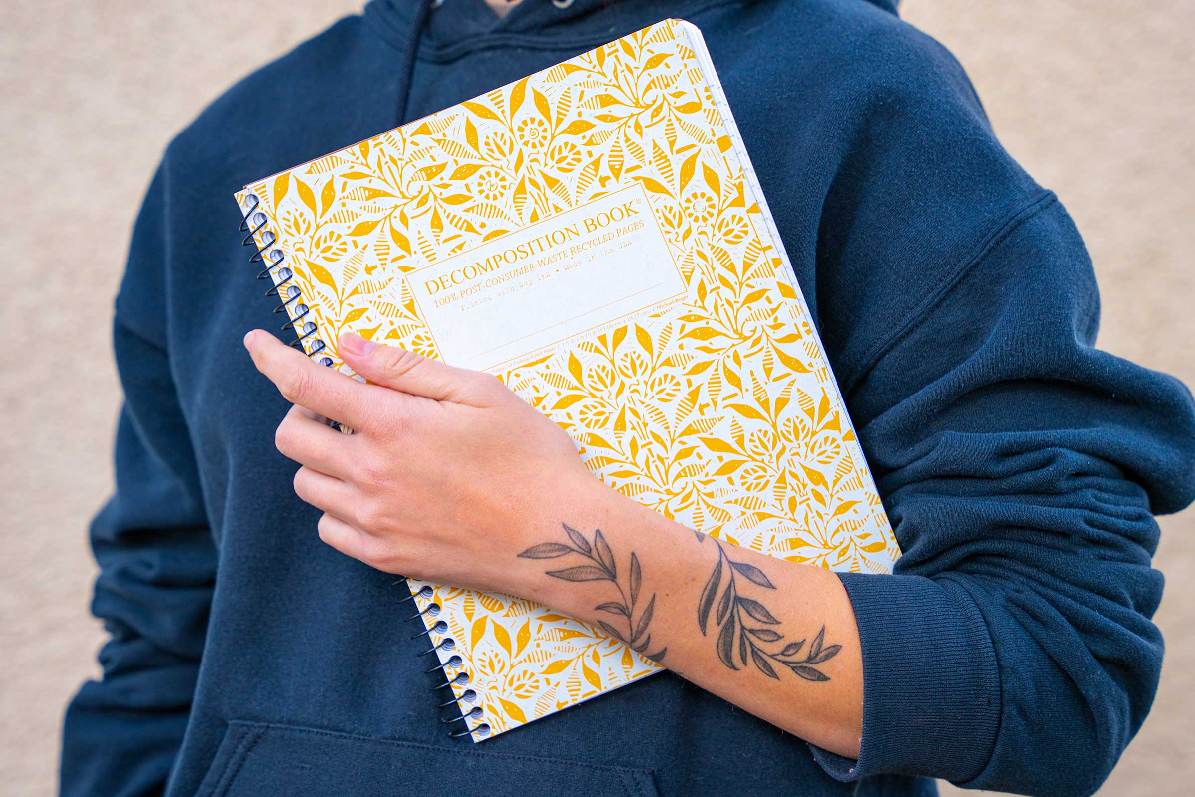 Person holding a notebook