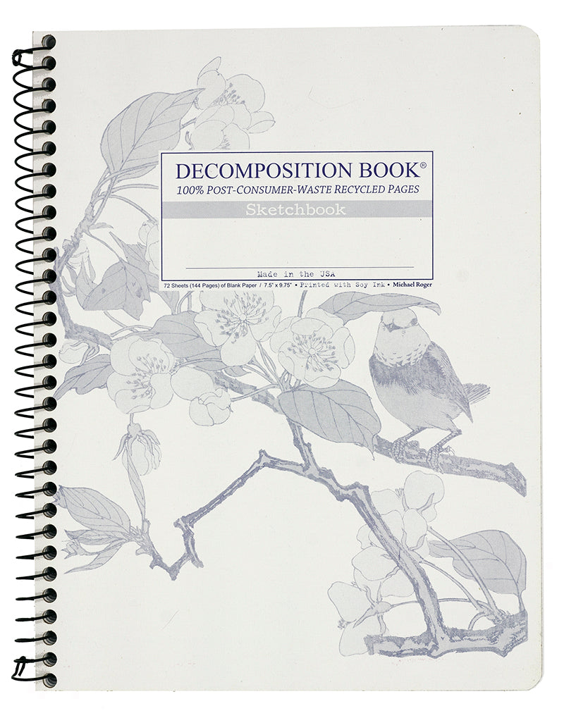 Spiral notebook printed with a bird on a flowering branch in blue