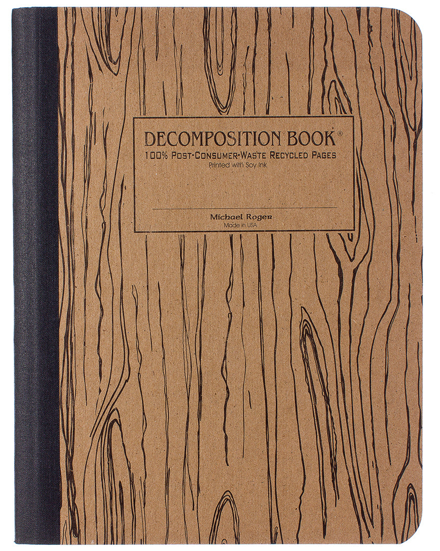 Composition notebook printed with a woodgrain pattern in black and brown