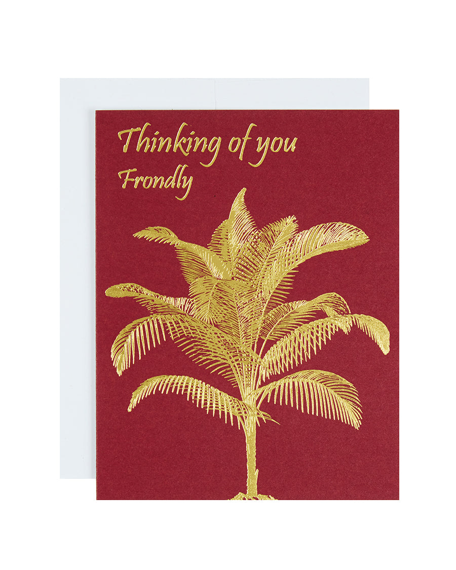 Greeting card with the text Thinking of you Frondly and a foil palm frond