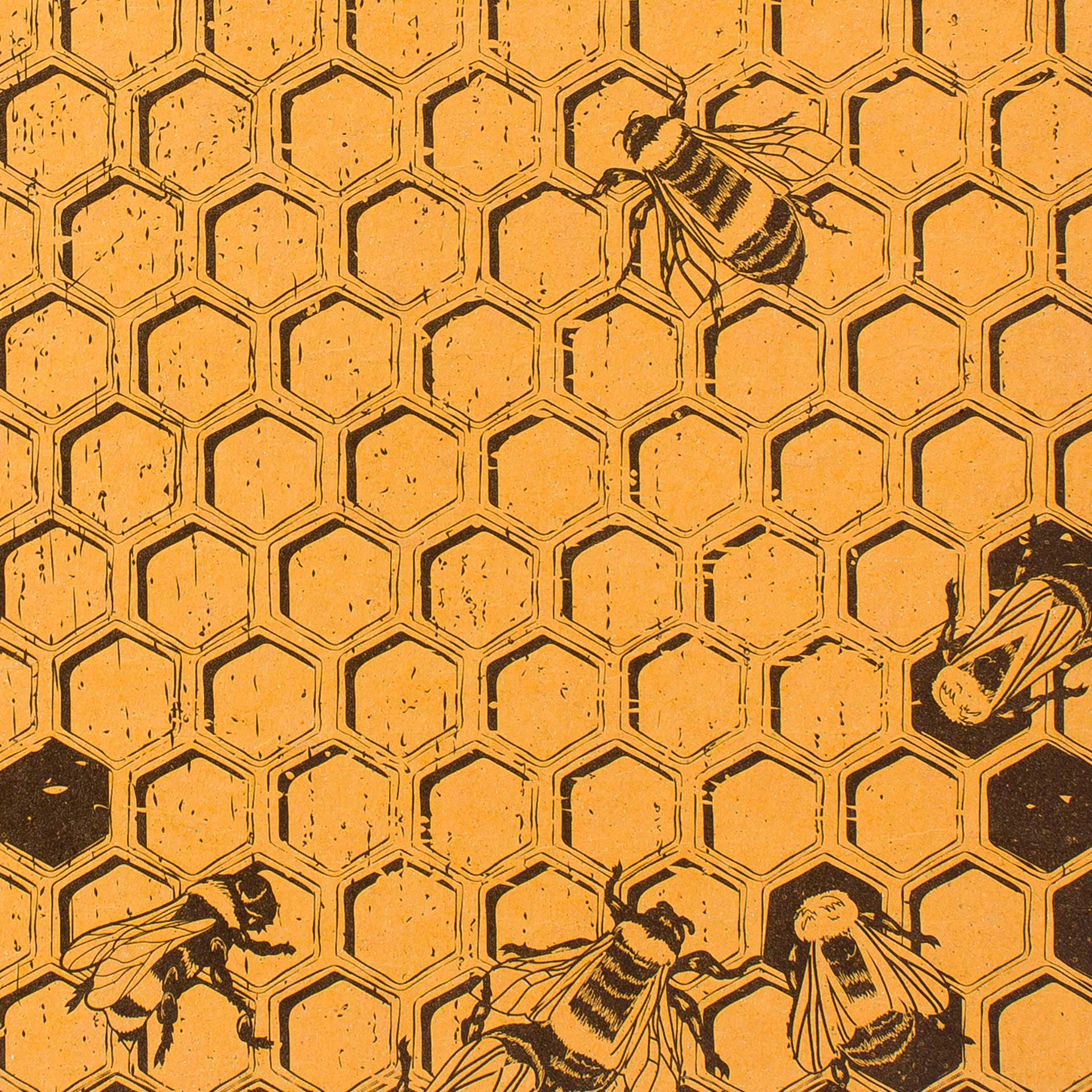 Closeup of a printed honeycomb pattern and bees