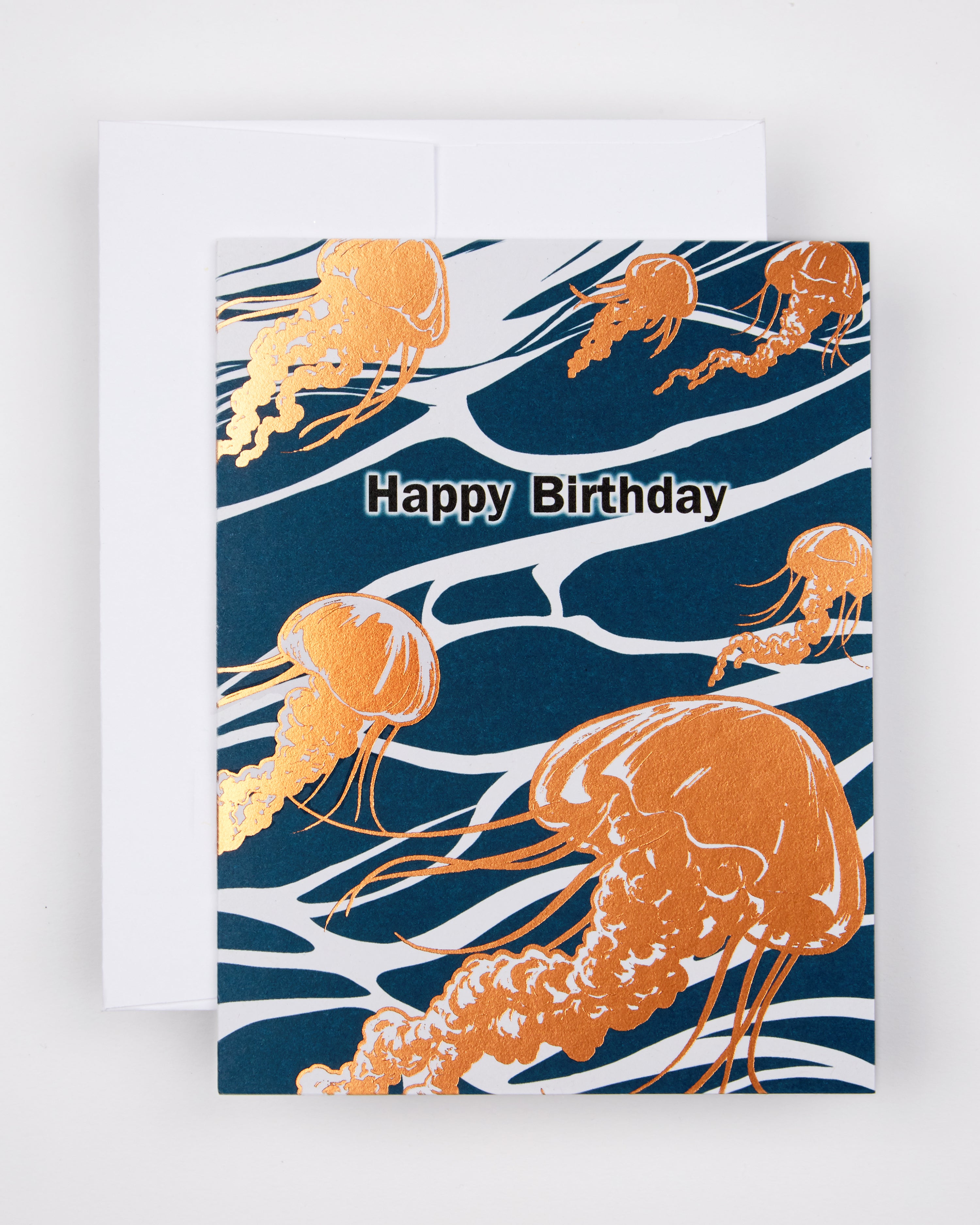 Greeting card with the text Happy Birthday amid golden jellyfish