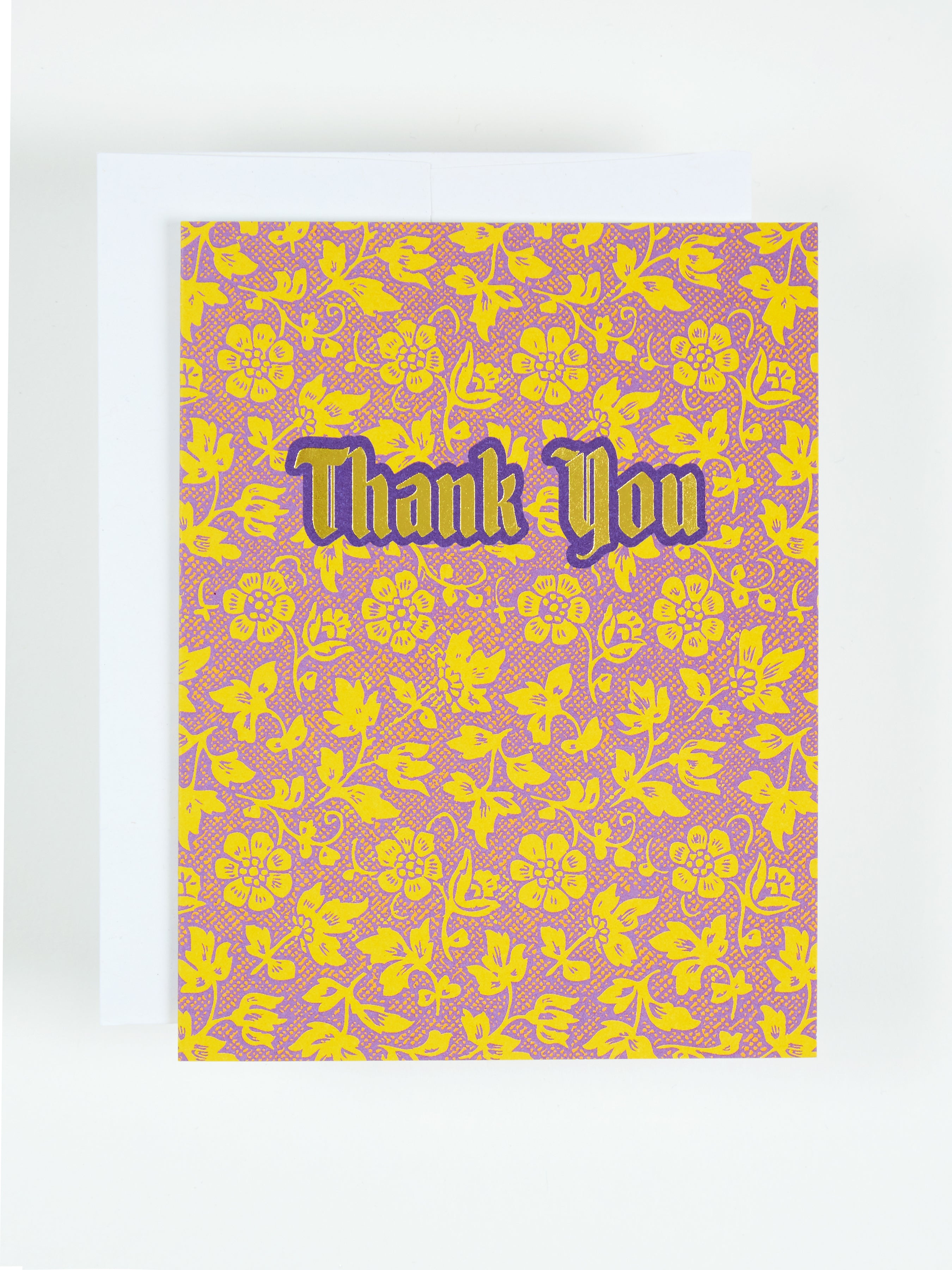 Greeting card featuring the text Thank You over a pattern of yellow flowers
