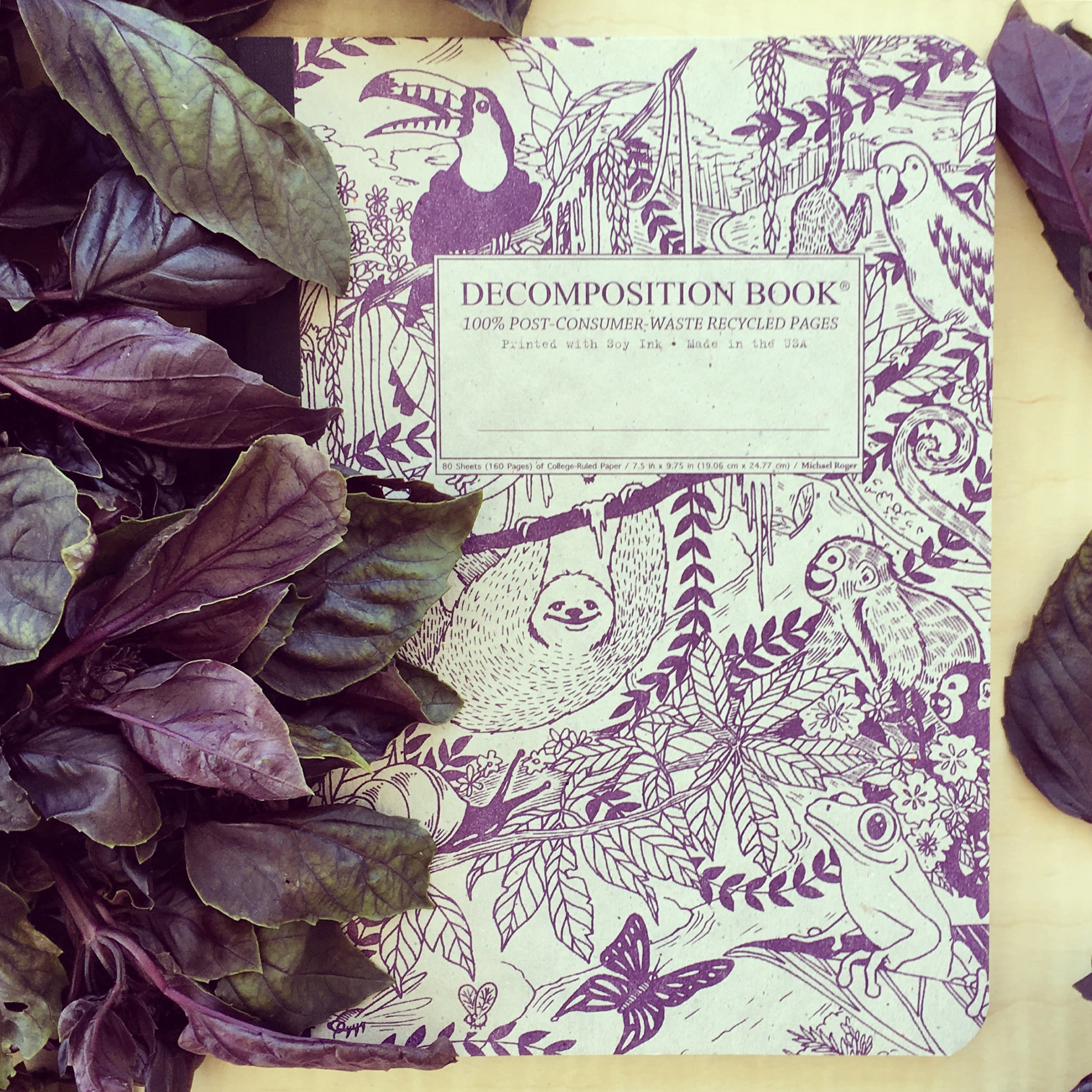 Composition notebook printed with jungle animals in purple