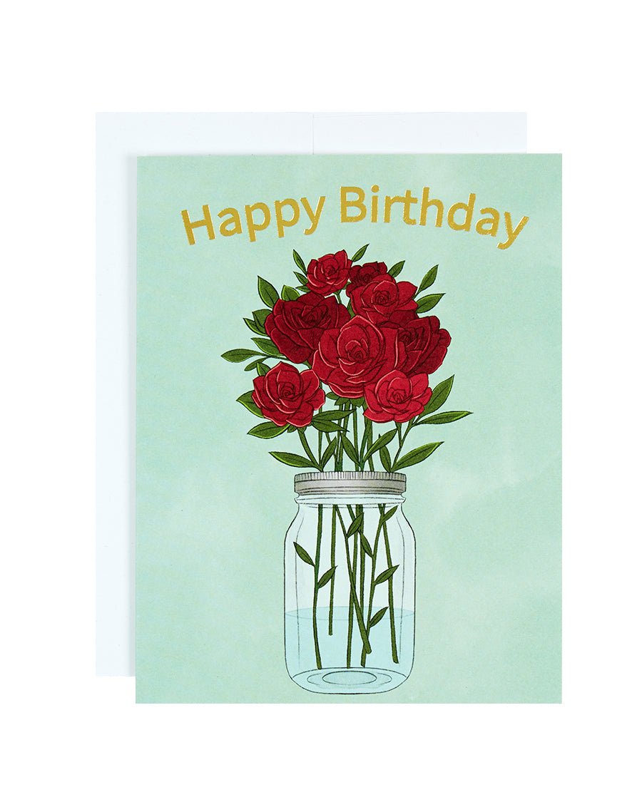 Greeting card with the text Happy Birthday above a jar of red roses