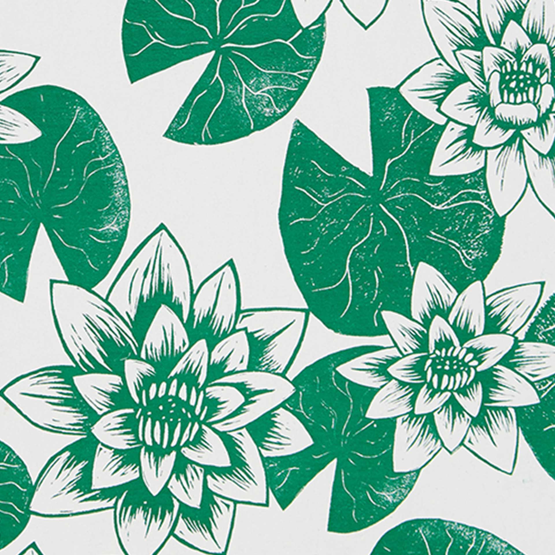 Closeup of green printed lily pads and flowers