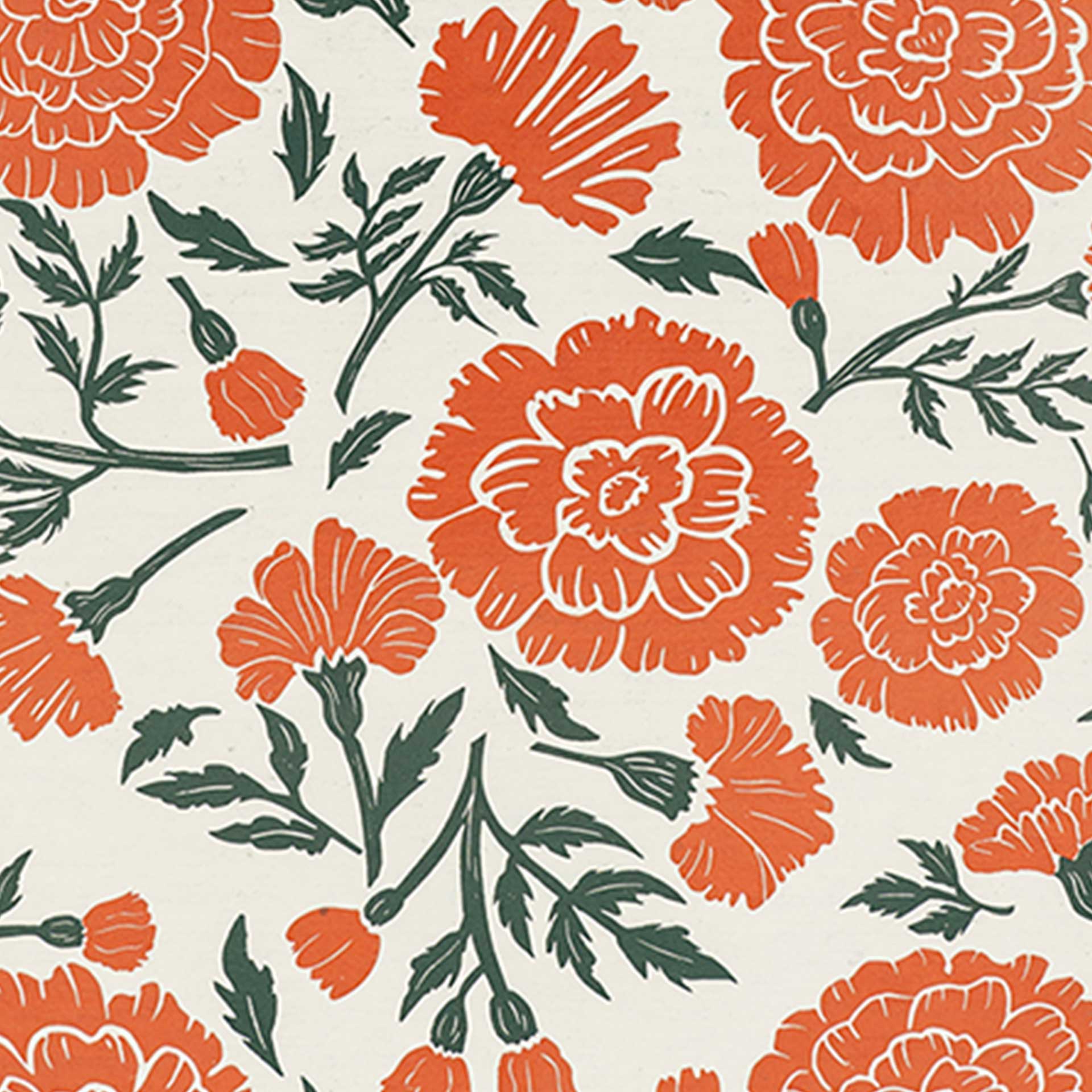 Closeup of large flowers printed in orange and green