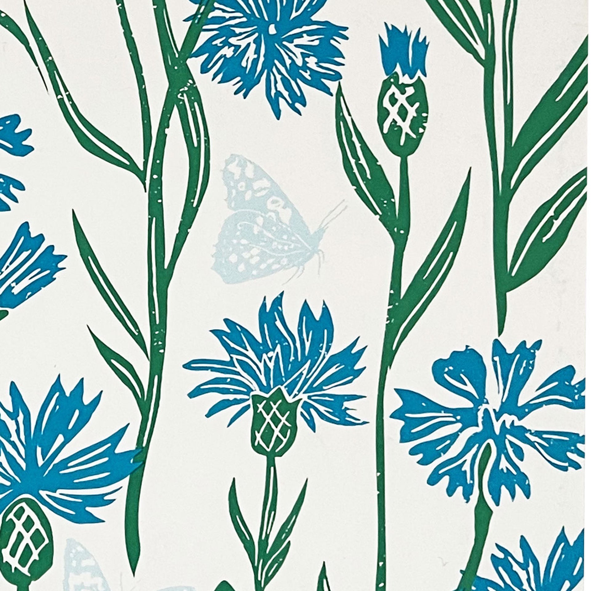 Closeup of a pattern of blue and green flowers