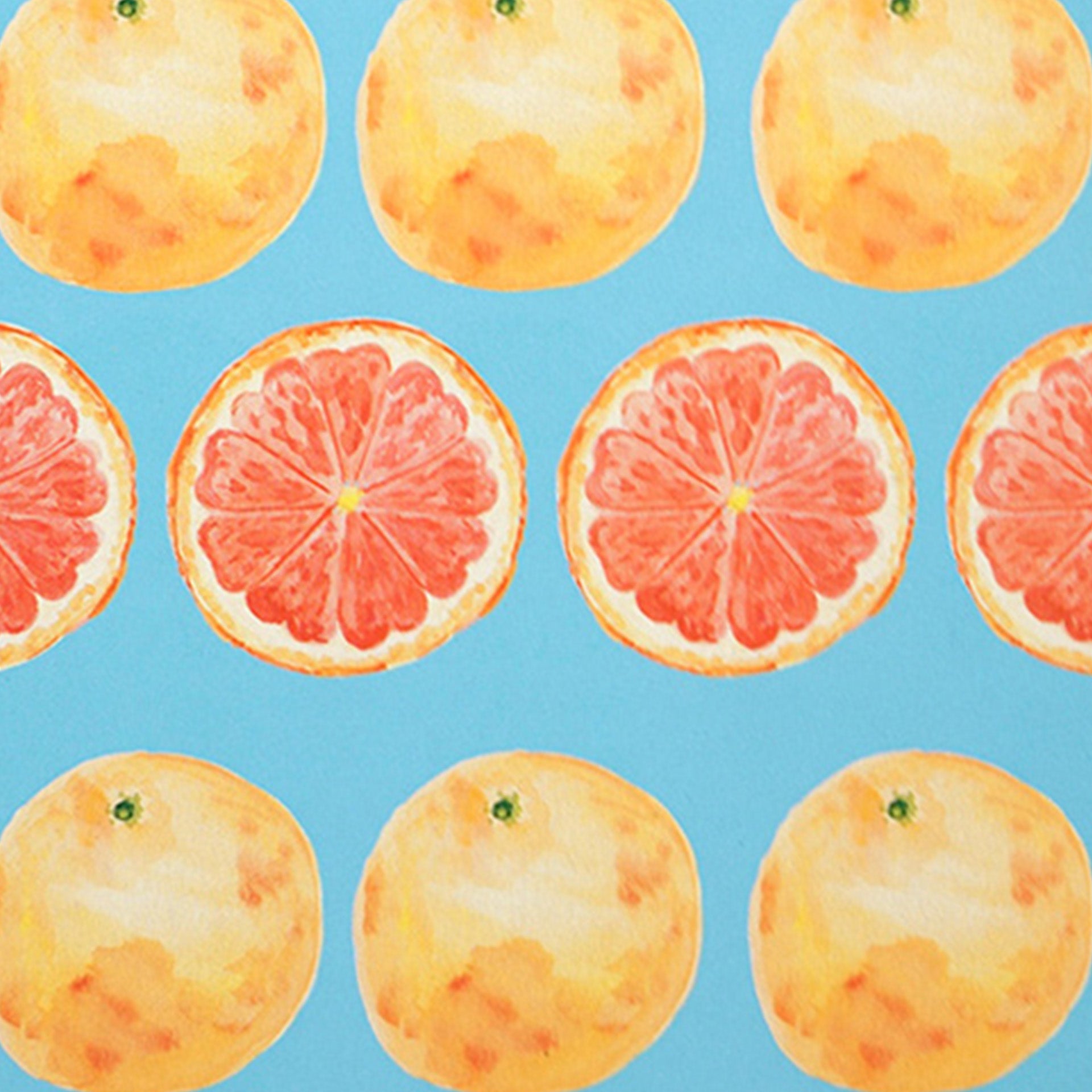 Closeup of watercolor grapefruits printed on blue