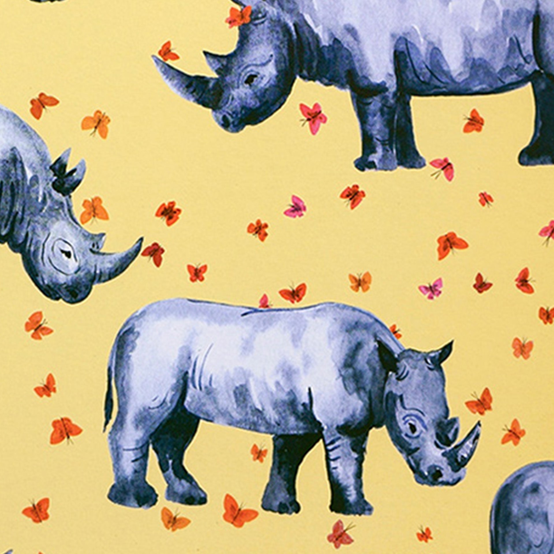 Closeup of rhinoceroses and butterflies printed on yellow